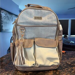 Itzy Ritzy Gray and Cream Backpack with Modern Tassel Charm